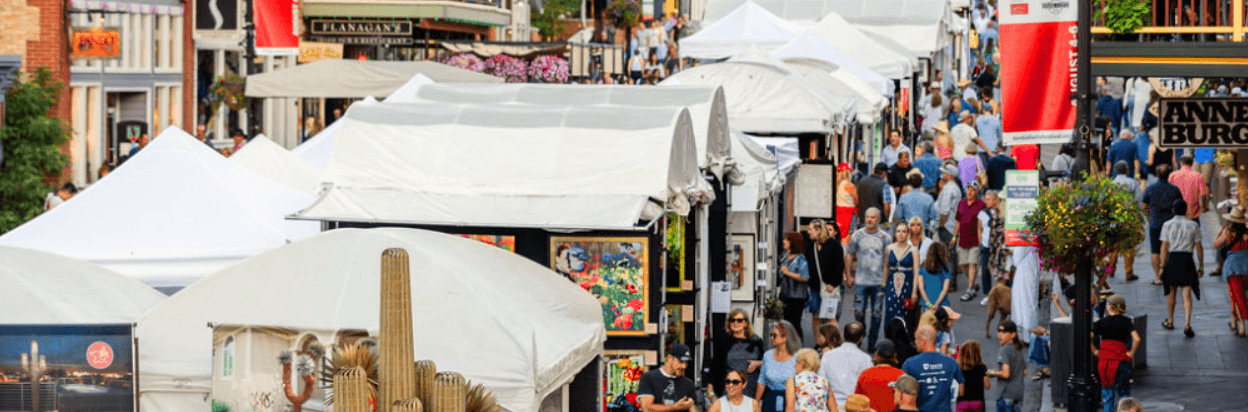 Artist booths lining a street at the Kimball Arts Festival